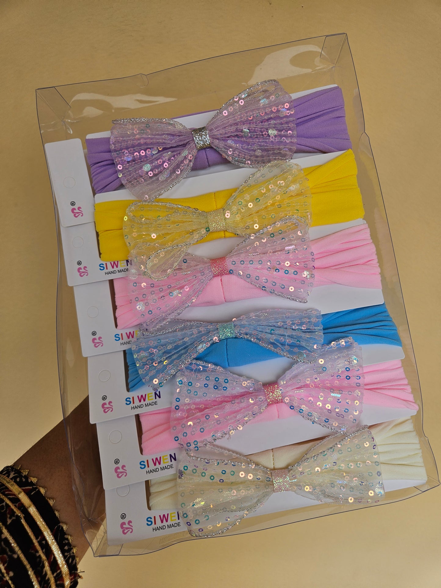 Sequence elastic bow headband