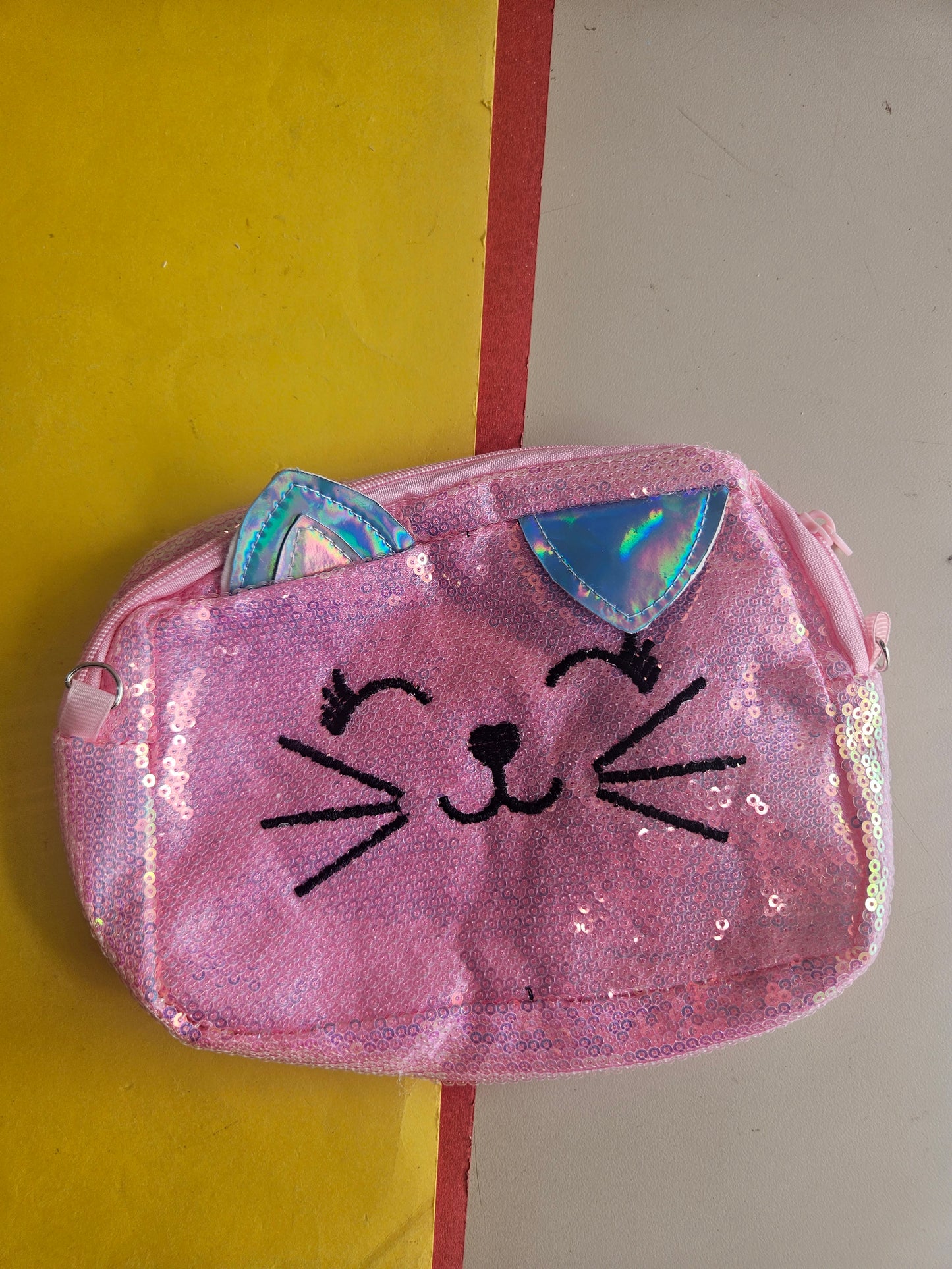 Sequence kitty sling bags