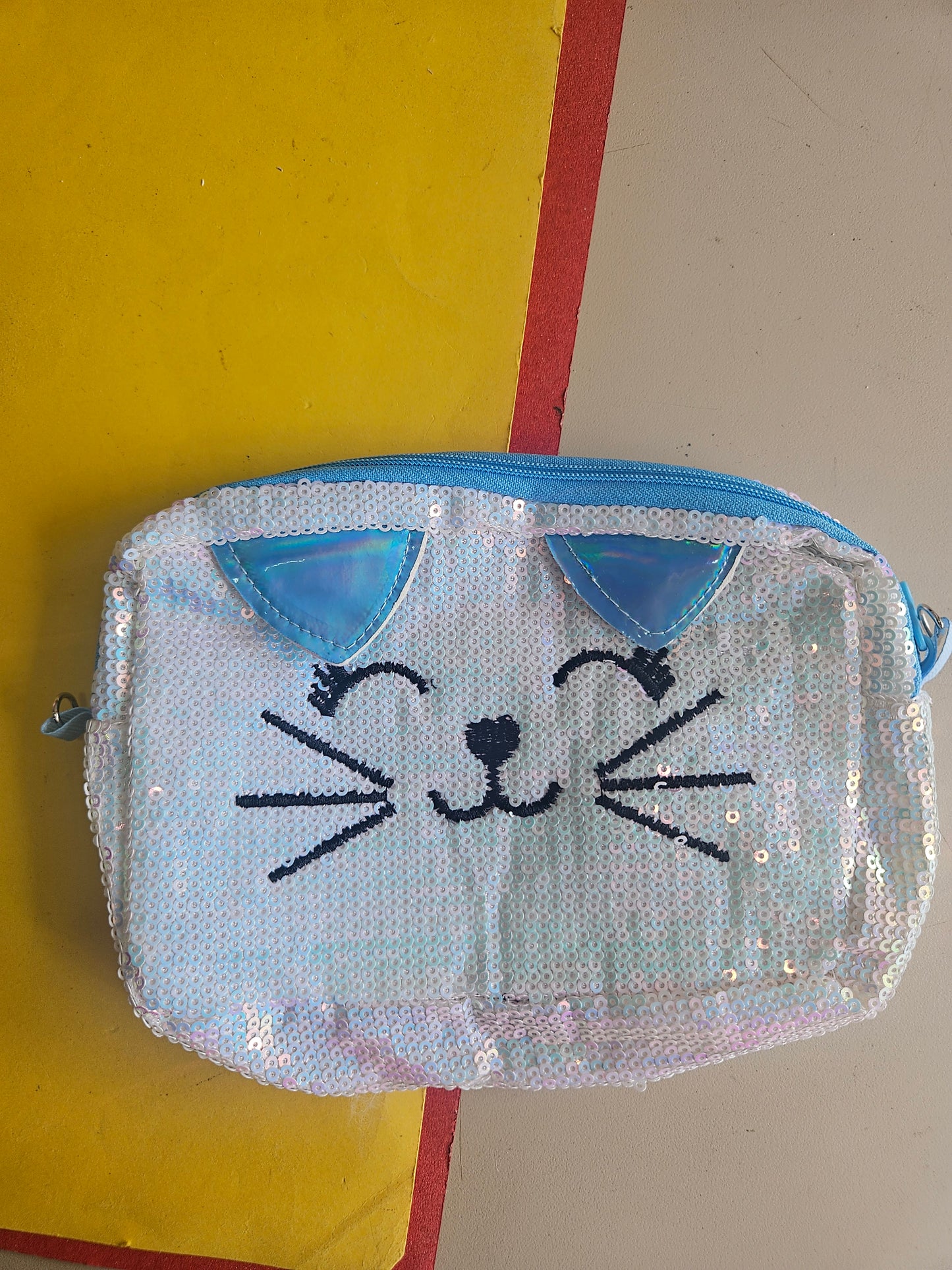 Sequence kitty sling bags