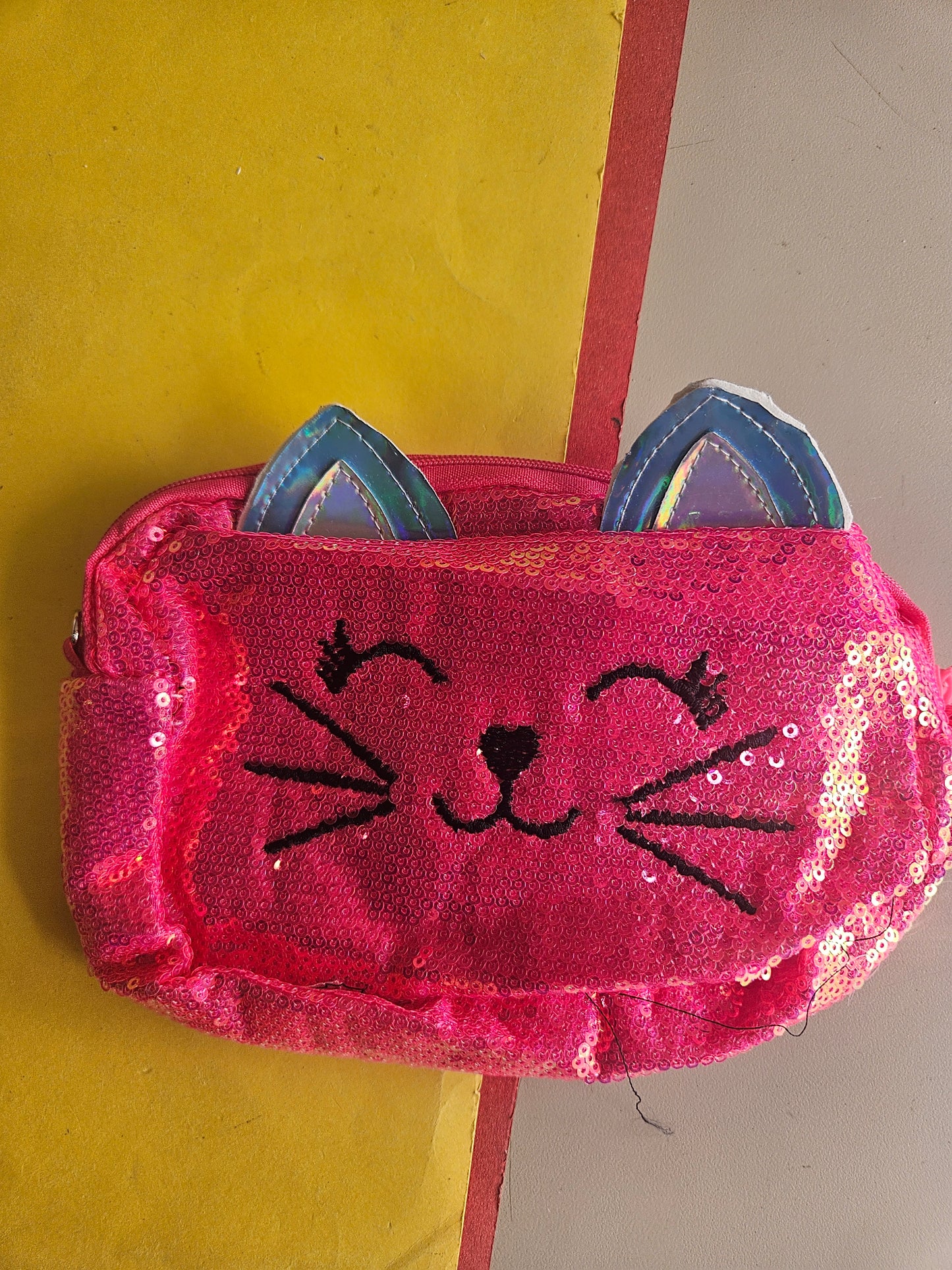 Sequence kitty sling bags