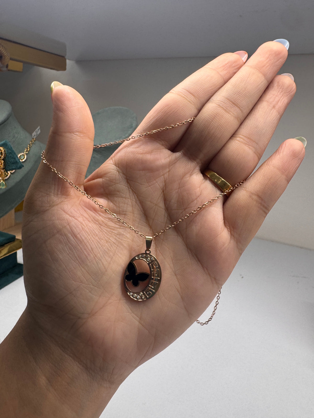Rose gold butterfly circular pendant necklace