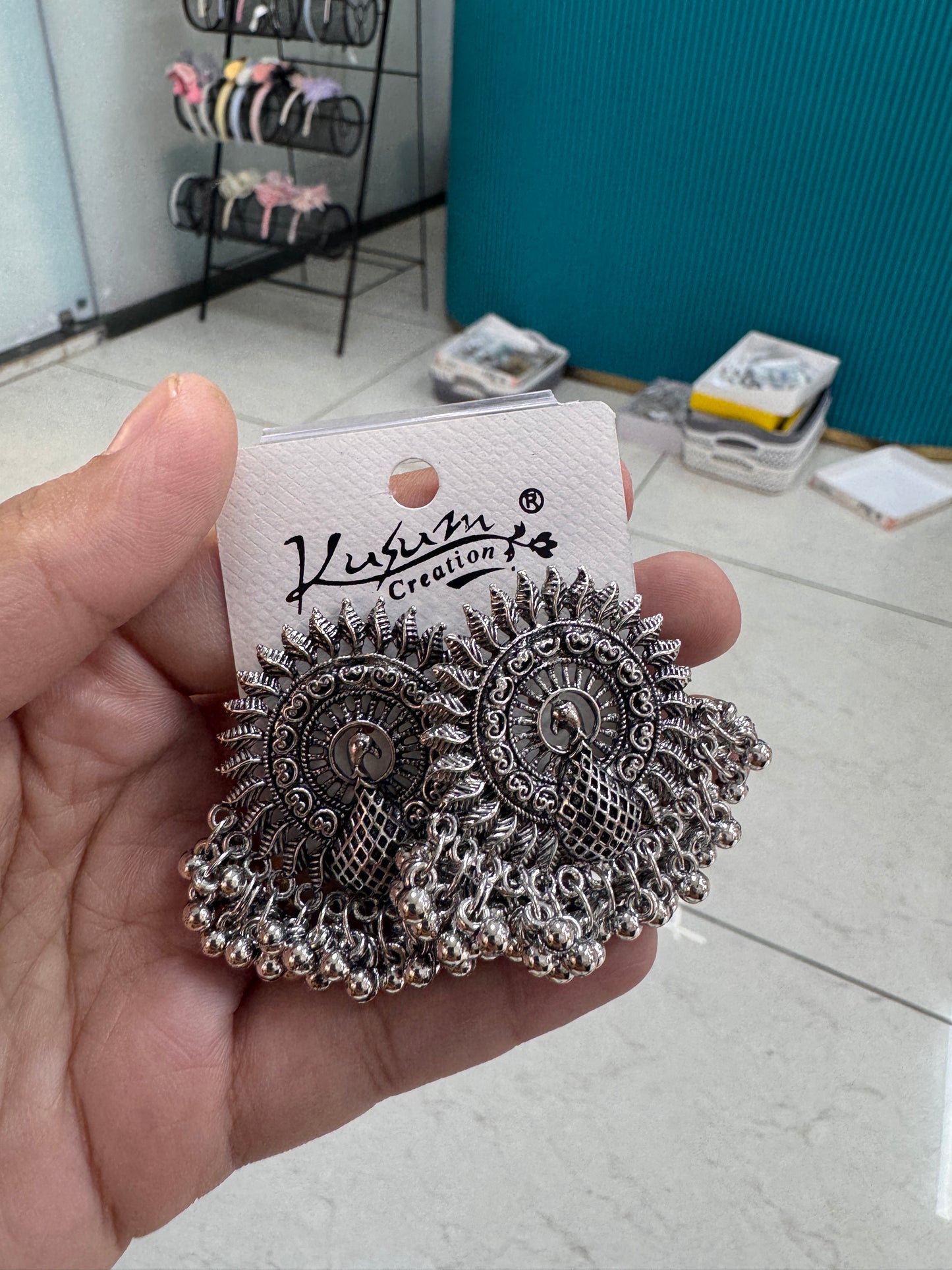 Peacock silver studs