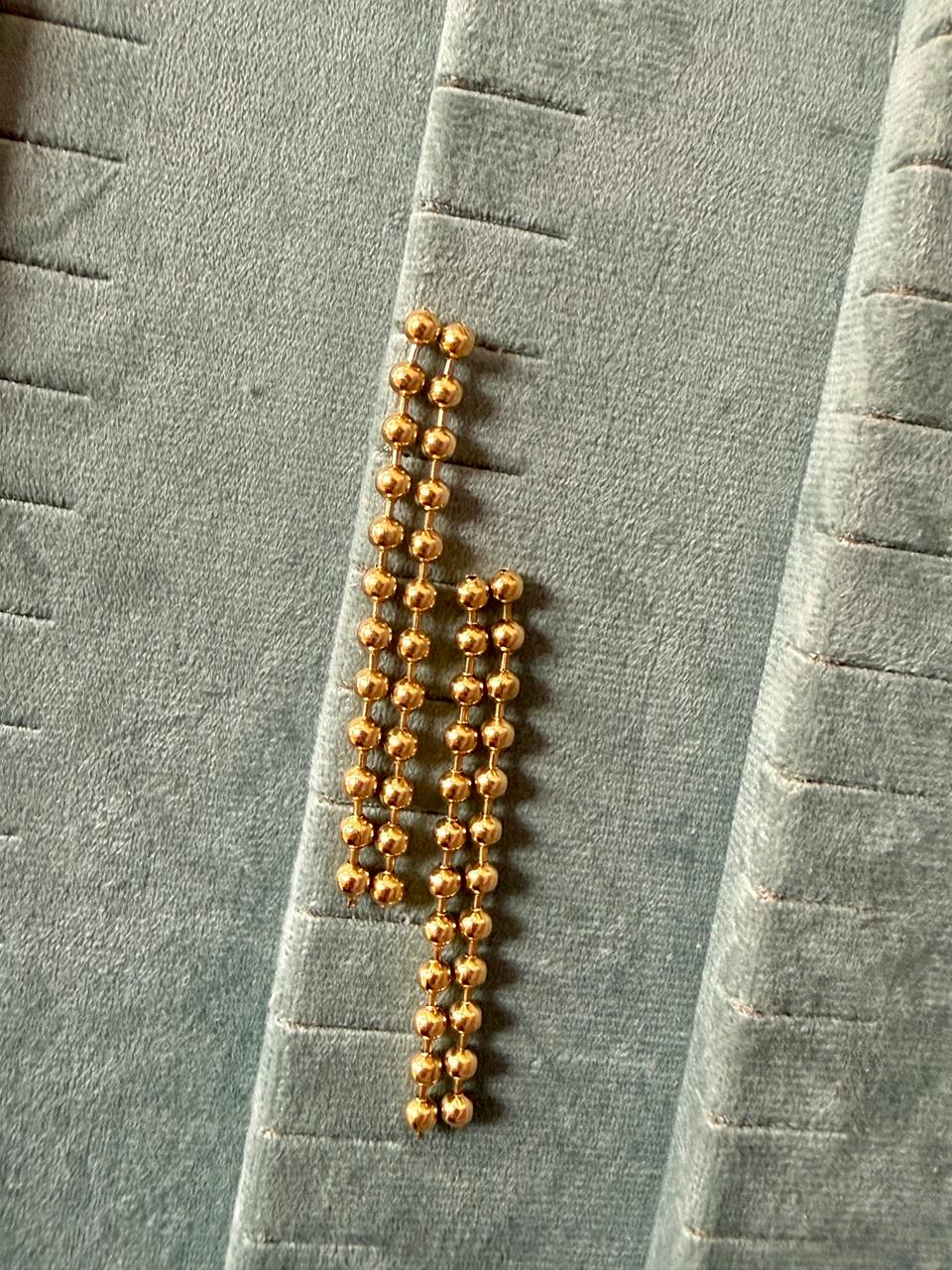 Gold bead ear hangings